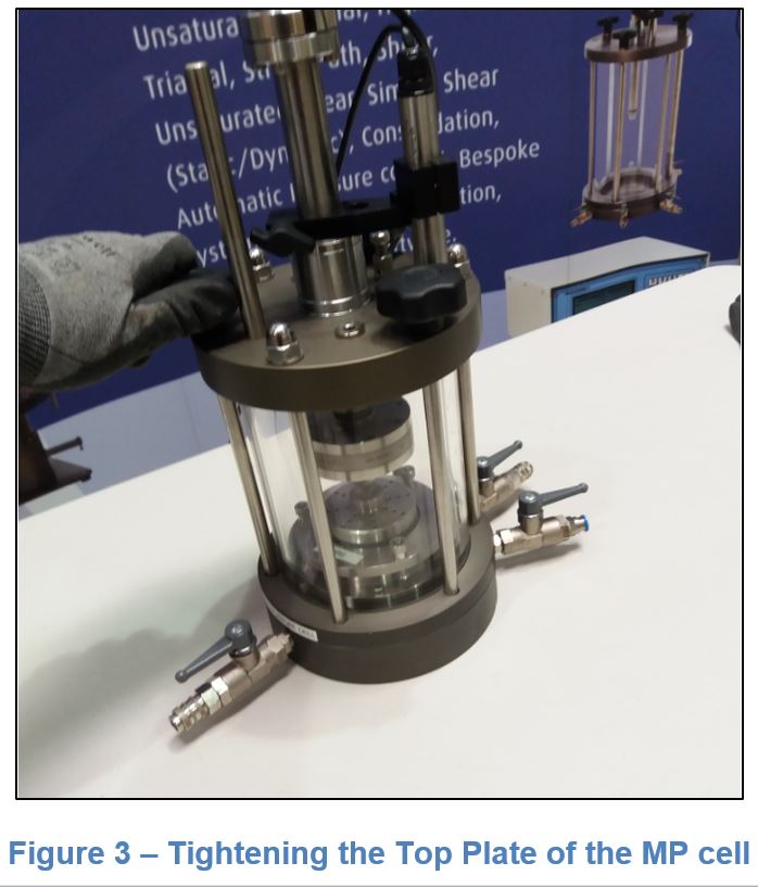 Figure 3. Tightening the Top Plate of the MP Cell for a constant rate of strain test